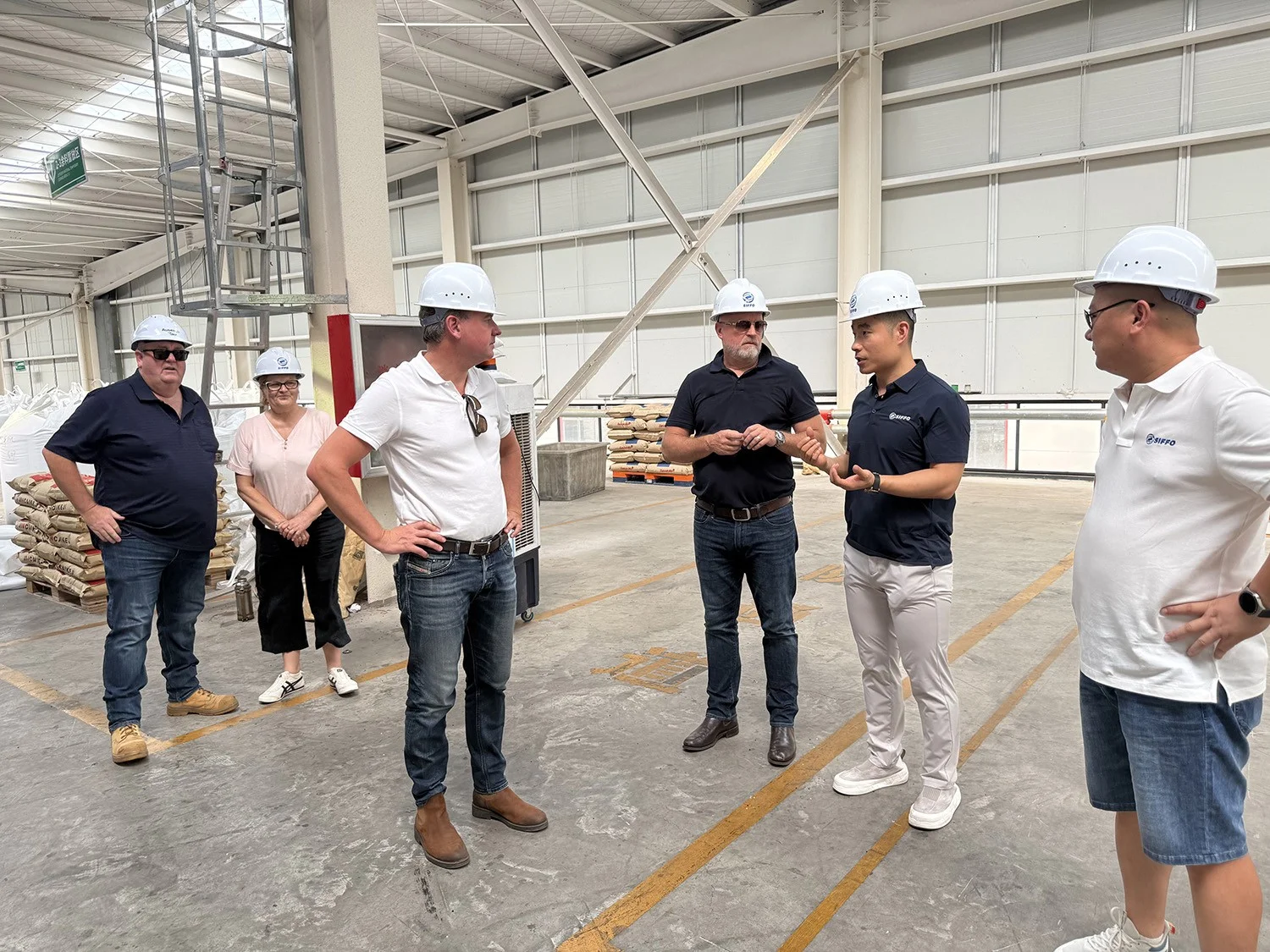 German clients discussing HDPE pipe production with the SIFFO team