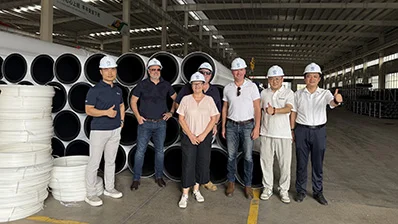 German customers inspecting White Co-Extruded HDPE Pipe