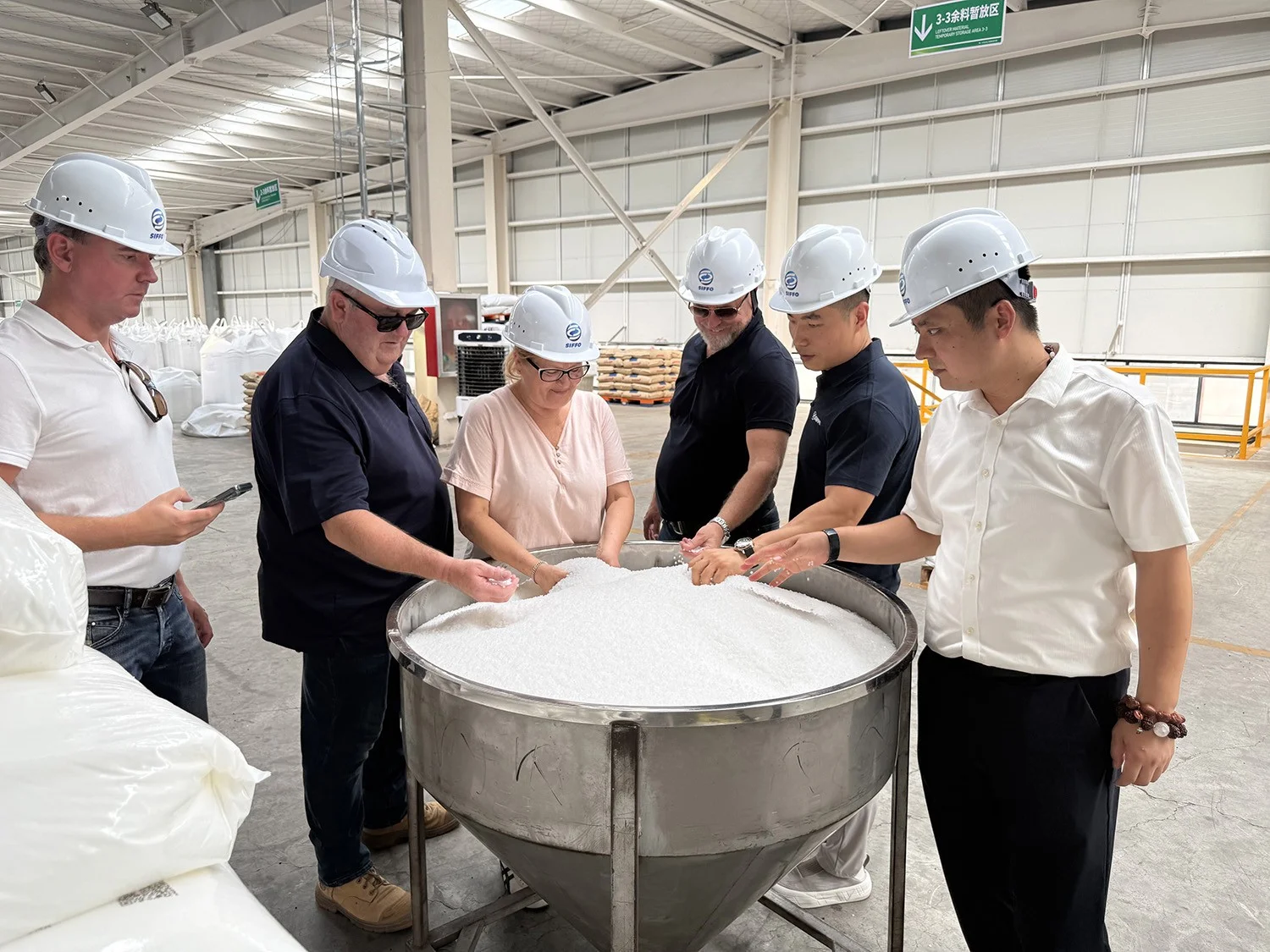 German clients examining raw materials for White Co-Extruded HDPE Pipe