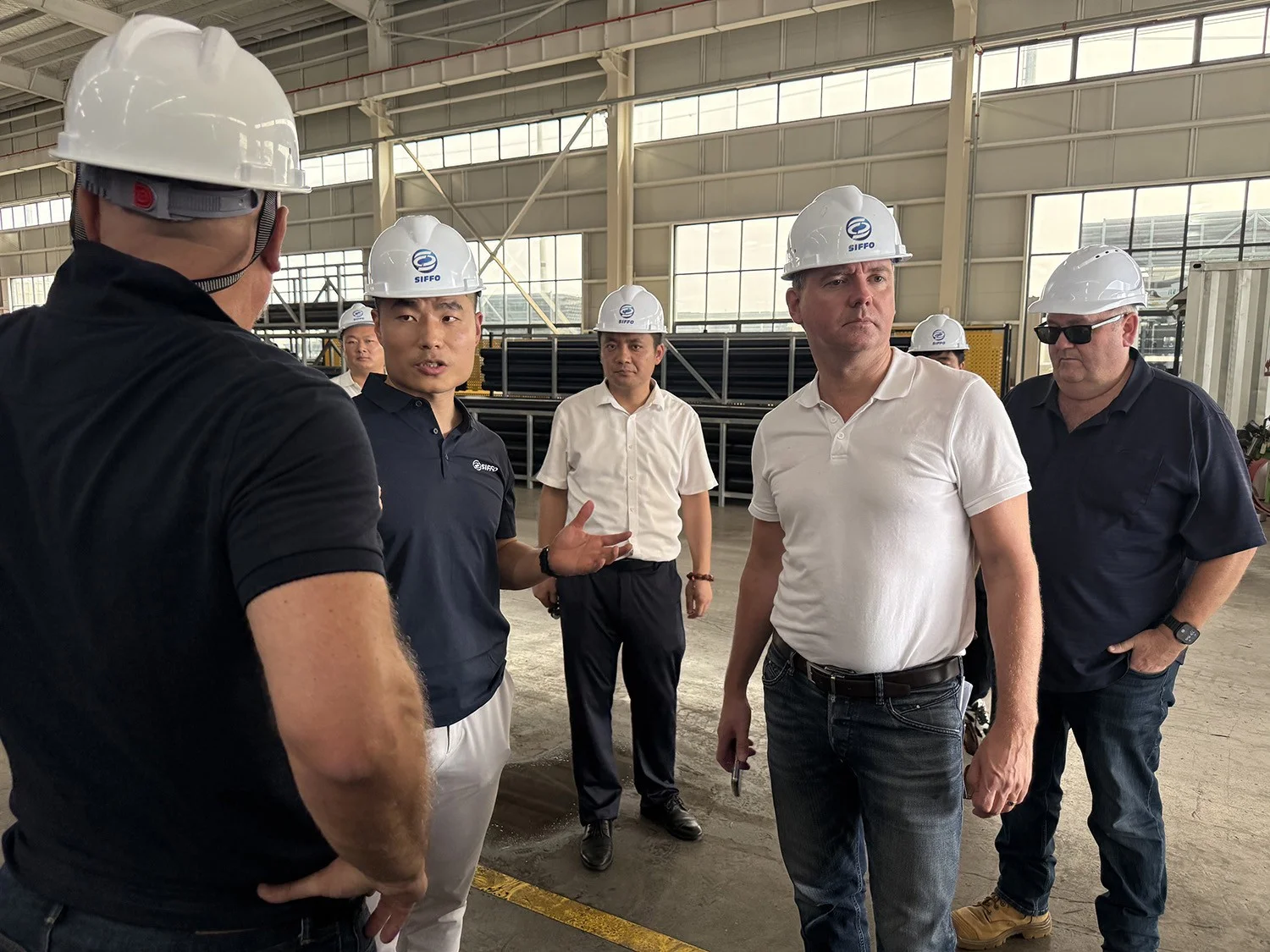 German clients discussing HDPE pipe production with the SIFFO team