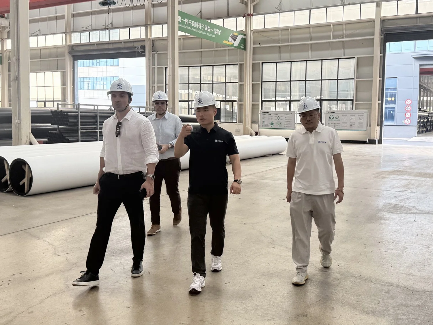 Spanish customer delegation touring SIFFO’s HDPE pipe manufacturing workshop with Mr. Xu and Quality Engineer Miao